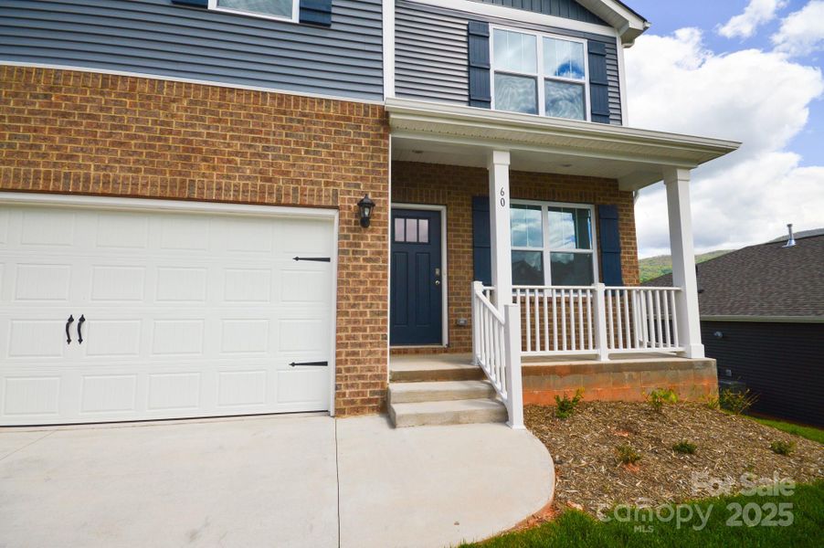 Front exterior of a new home in Valleywood Farms, Waynesville, NC, highlighting curb appeal (Image 2). Front exterior of a new home in Valleywood Farms, Waynesville, NC, highlighting curb appeal (Image 2).