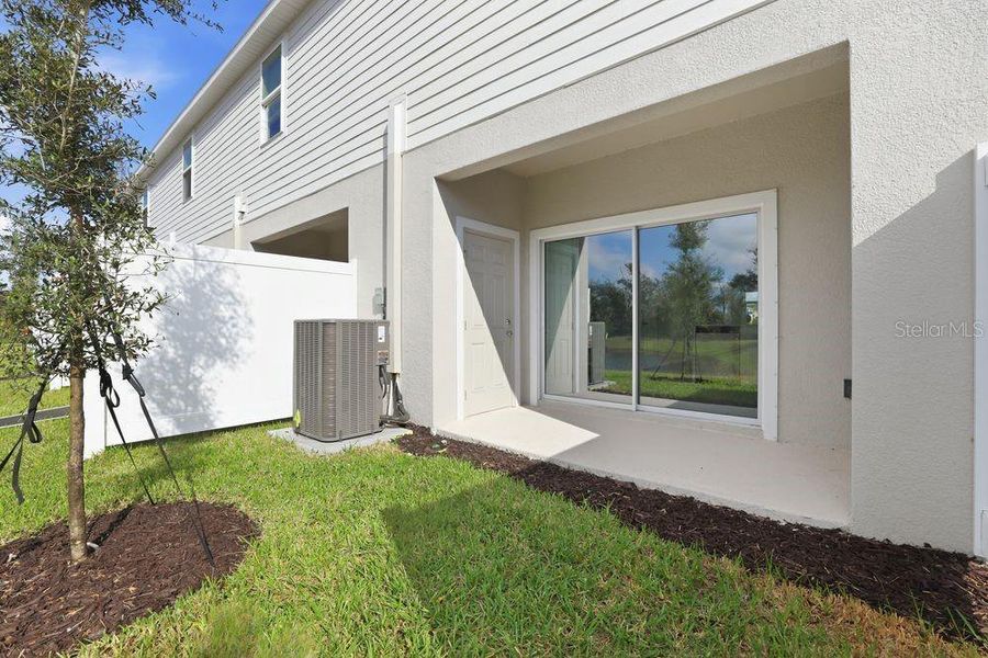 Exterior details and patio area of a home in The Towns at Firethorn, Parrish (Image 18).