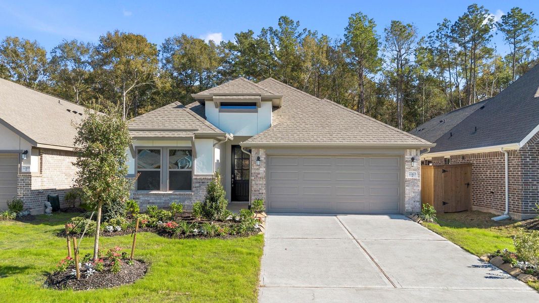 Front exterior of a new home in The Highlands 45', Porter, TX, highlighting curb appeal (Image 22).