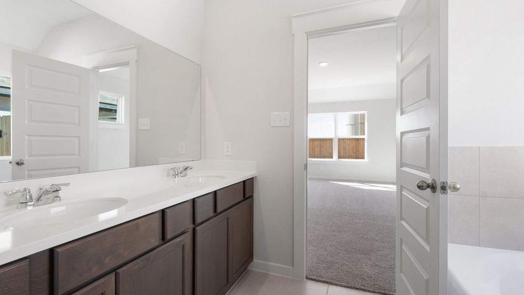 Representative furnished interior of a home built from the Blanton by Brightland Homes in Sunterra, Katy (Image 14).