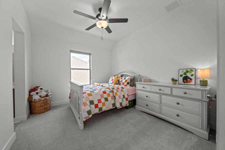 Spacious and bright, this secondary bedroom offers room to grow with an ensuite bath just steps away. Spacious and bright, this secondary bedroom offers room to grow with an ensuite bath just steps away.