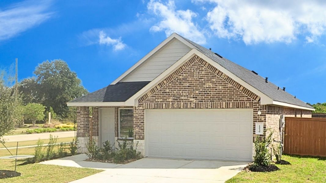 Front exterior of a new home in Cypress Green, Hockley, TX, highlighting curb appeal (Image 1).