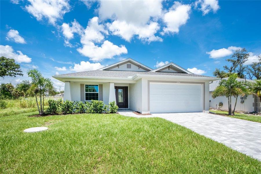 Front exterior of a new home in , Rotonda West, FL, highlighting curb appeal (Image 30). Front exterior of a new home in , Rotonda West, FL, highlighting curb appeal (Image 30).