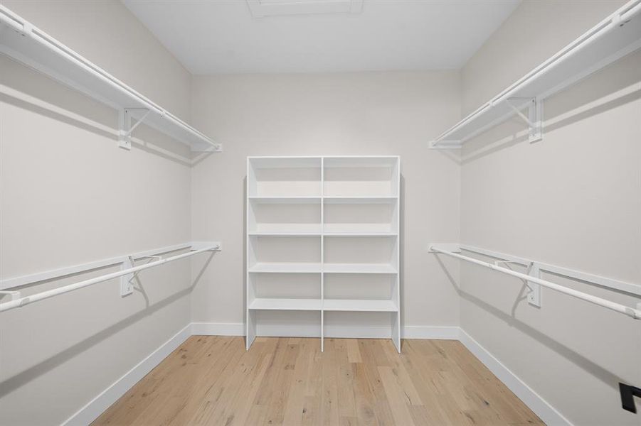 Walk in closet featuring light wood-type flooring