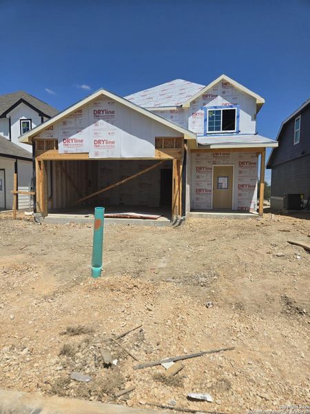 Front exterior of a new home in Abbott Place, St. Hedwig, TX, highlighting curb appeal (Image 2).