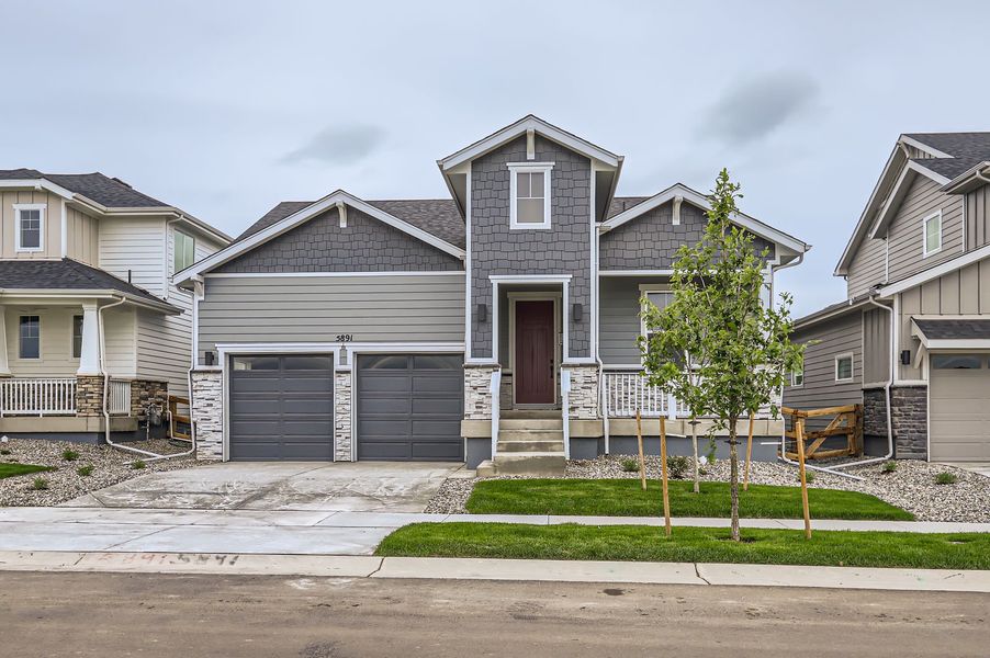 Front exterior of a new home in Barefoot Lakes, Longmont, CO, highlighting curb appeal (Image 2).