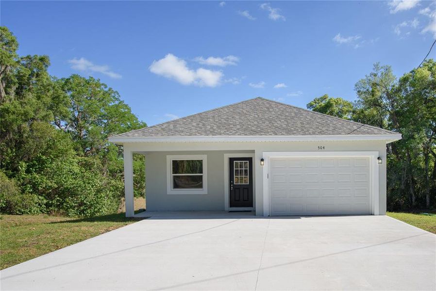 Front exterior of a new home in , Deland, FL, highlighting curb appeal (Image 1).