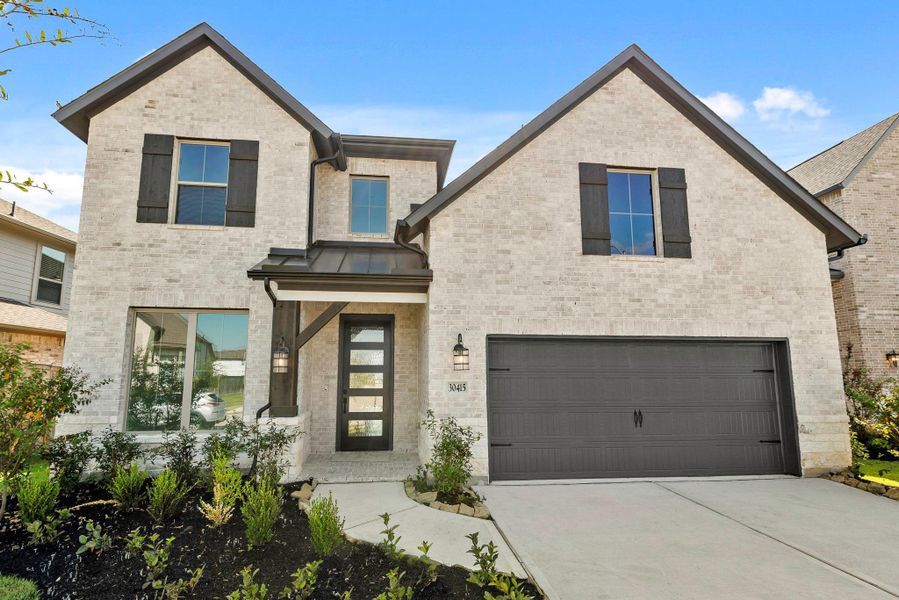 Front exterior of a new home in , Brookshire, TX, highlighting curb appeal (Image 1).