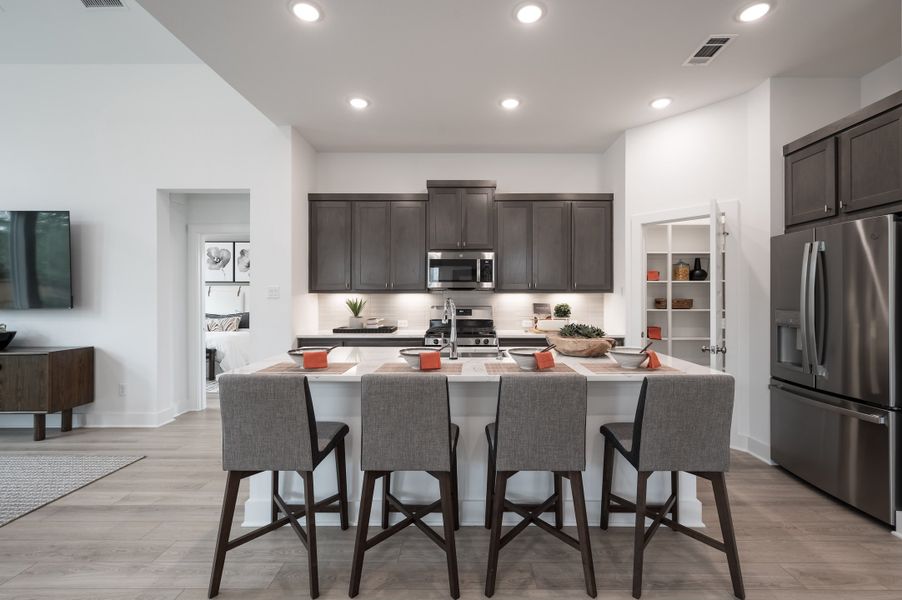 Representative furnished interior of a home built from the Wren by Tri Pointe Homes in Oakhill Reserve, Tomball (Image 10).