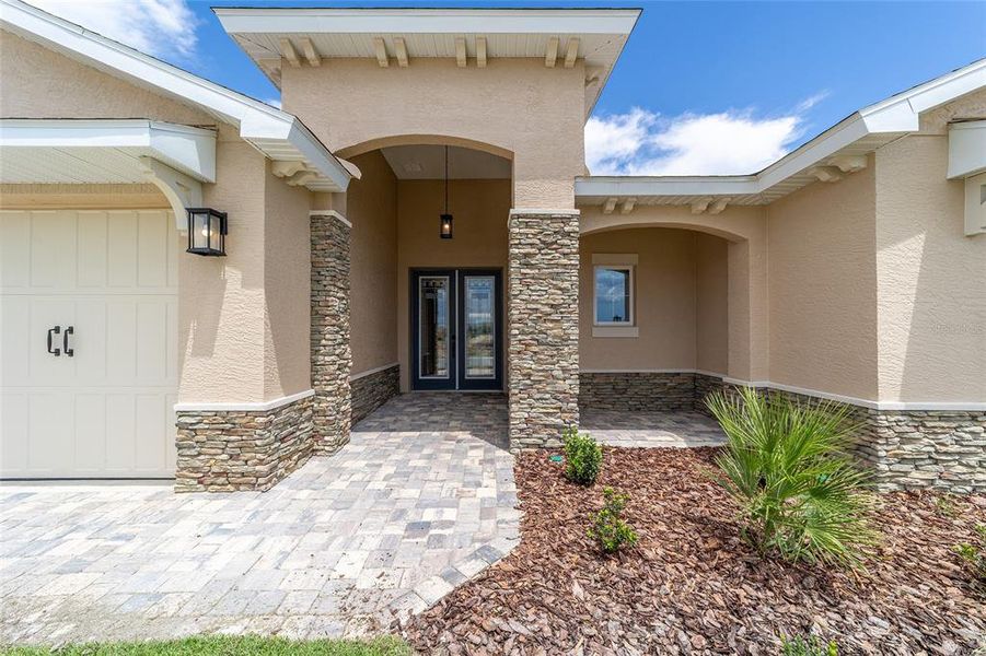 Exterior details and patio area of a home in On Top of the World Communities, Ocala (Image 25).