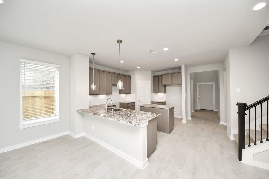 This generously spacious kitchen is a dream realized! Sample photo of completed home with similar floor plan. Actual colors and selections may vary. This generously spacious kitchen is a dream realized! Sample photo of completed home with similar floor plan. Actual colors and selections may vary.