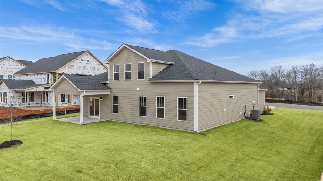 Exclusive rear covered porch with accomplished detail and elevated outdoor living potential