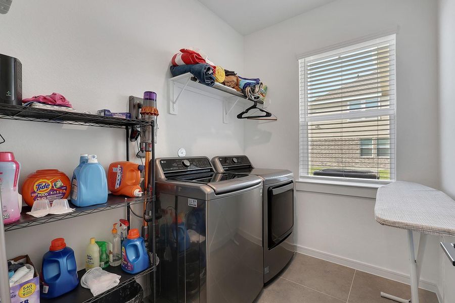 Well-organized laundry room provides great natural light.