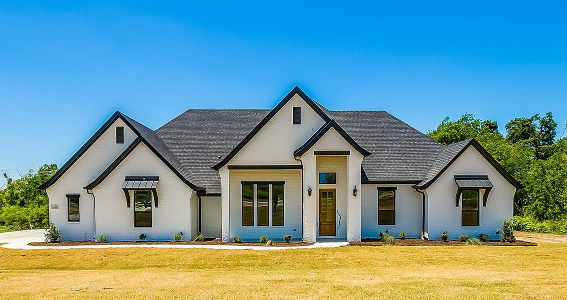 Representative exterior photo of a completed home built from the 151-2557-1018 by Abba River Homes in Stanford Estates, Springtown, TX (Image 1). Representative exterior photo of a completed home built from the 151-2557-1018 by Abba River Homes in Stanford Estates, Springtown, TX (Image 1).