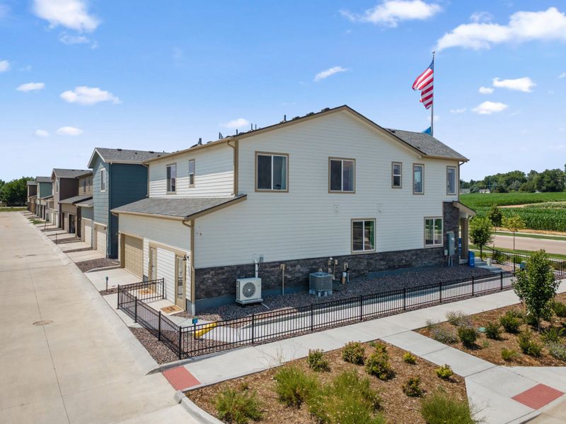 Representative exterior photo of a completed home built from the Biscayne by Landsea Homes in Pintail Commons at Johnstown Village, Johnstown, CO (Image 23).