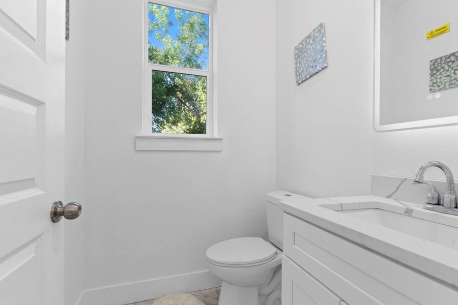 Convenient half bath located on the main floor for guests. Convenient half bath located on the main floor for guests.
