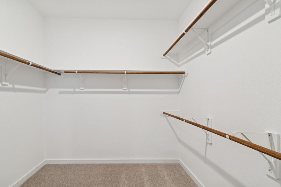 Primary walk-in closet (*Photo not of actual home and used for illustration purposes only.)