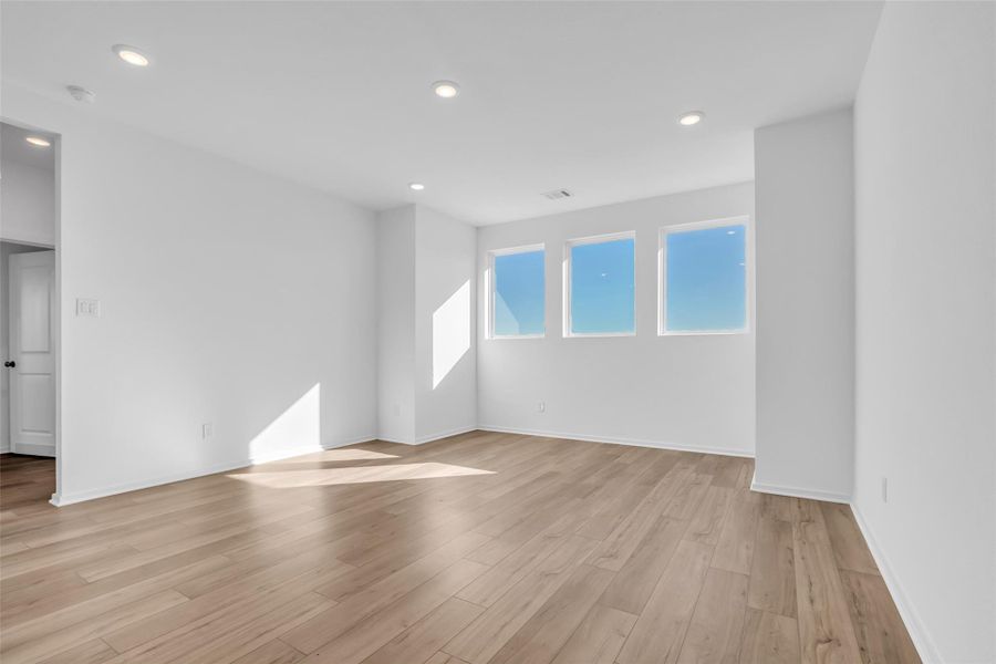 Spacious Upper-Level Flex Room: Substantial open space offering flexibility for a game room, secondary living area, or work-from-home setup, with room to define multiple zones. Spacious Upper-Level Flex Room: Substantial open space offering flexibility for a game room, secondary living area, or work-from-home setup, with room to define multiple zones.