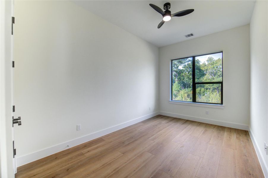 Located on the second floor, this bright third bedroom offers serene views and modern finishes. Located on the second floor, this bright third bedroom offers serene views and modern finishes.