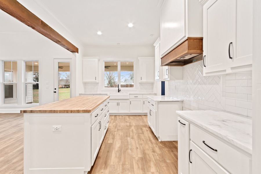 Representative furnished interior of a home built from the The Charlotte by Manuel Builders in Chapel Bend, Montgomery (Image 9).