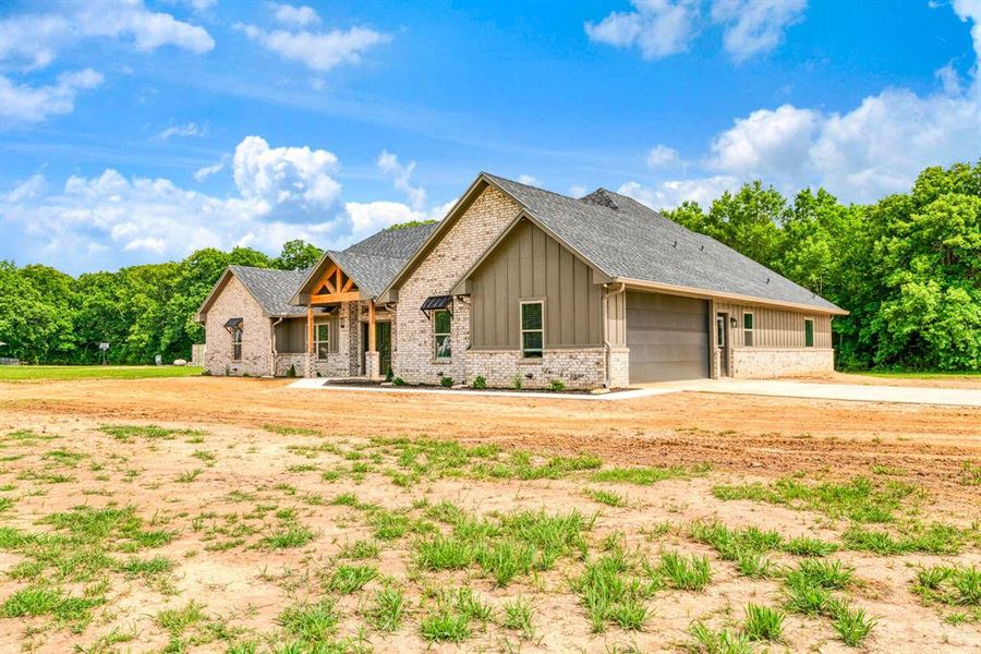 Front exterior of a new home in , Blossom, TX, highlighting curb appeal (Image 2). Front exterior of a new home in , Blossom, TX, highlighting curb appeal (Image 2).