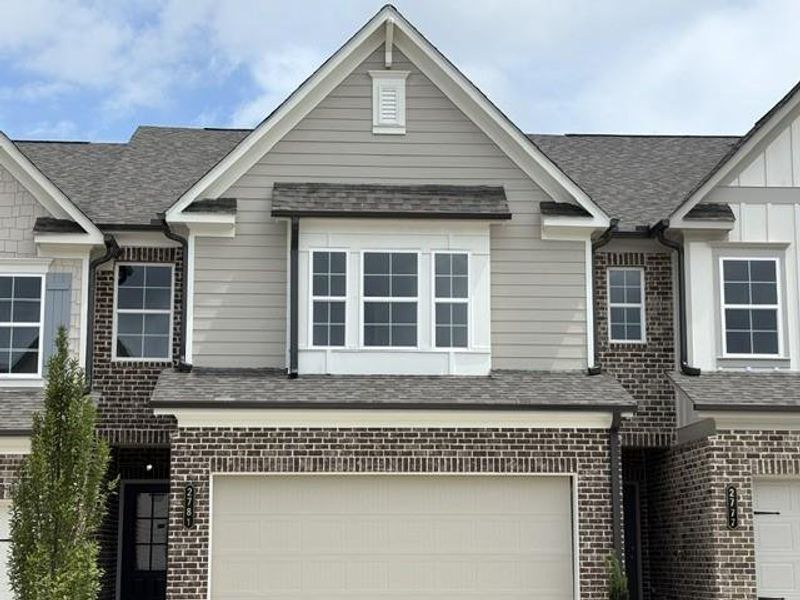 Front exterior of a new home in , Suwanee, GA, highlighting curb appeal (Image 1). Front exterior of a new home in , Suwanee, GA, highlighting curb appeal (Image 1).