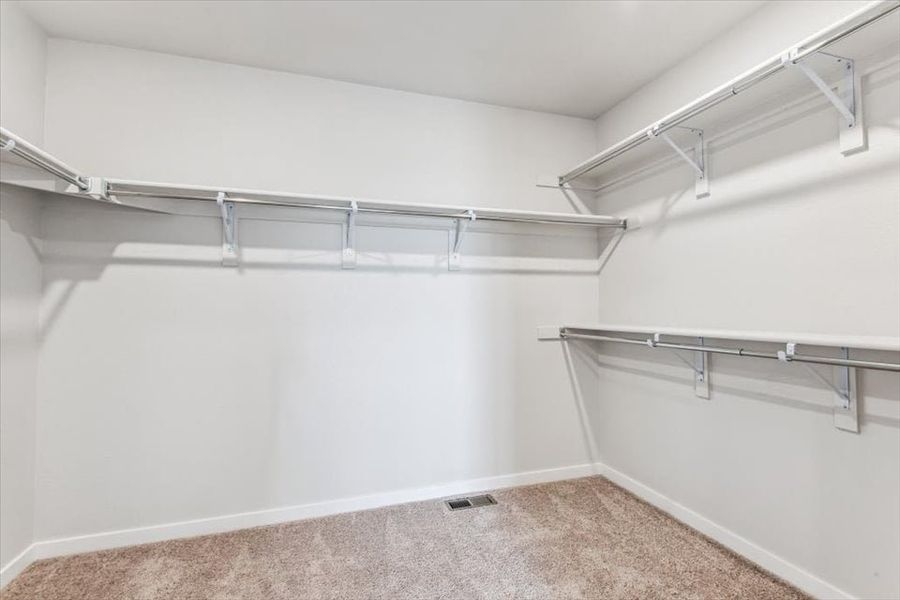 A white room with a metal railing.