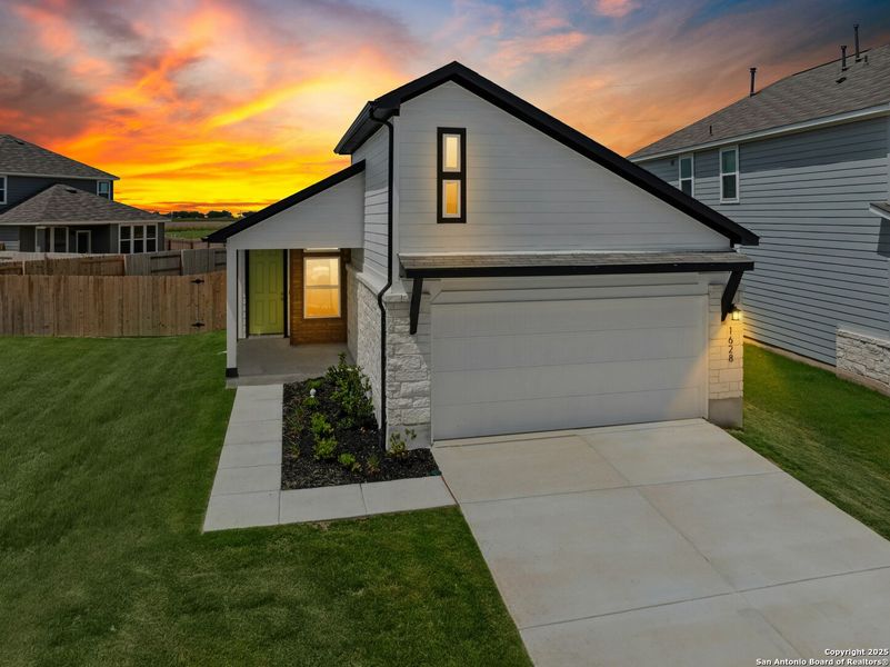 Front exterior of a new home in Willowbrook, New Braunfels, TX, highlighting curb appeal (Image 14). Front exterior of a new home in Willowbrook, New Braunfels, TX, highlighting curb appeal (Image 14).