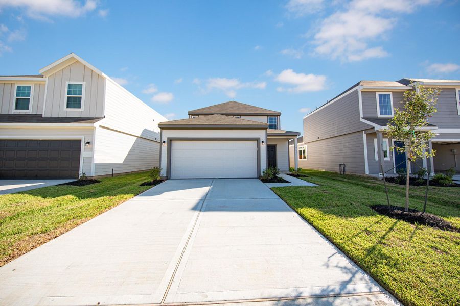 Front exterior of a new home in Wayside Village, Houston, TX, highlighting curb appeal (Image 13). Front exterior of a new home in Wayside Village, Houston, TX, highlighting curb appeal (Image 13).