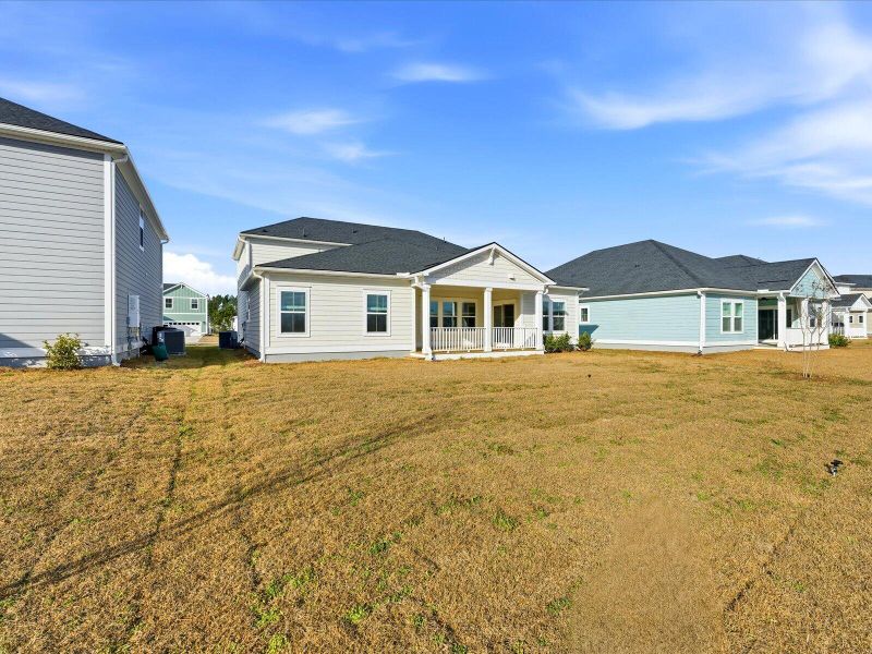 Exterior details and patio area of a home in The Coves at Lakes of Cane Bay II, Summerville (Image 3).
