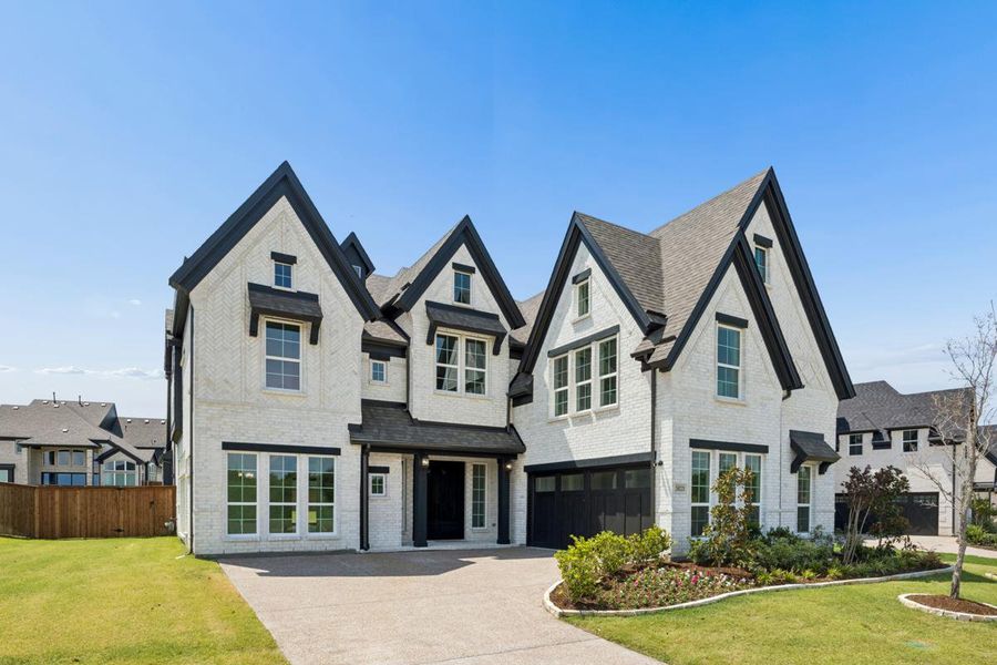Front exterior of a new home in Somerset Park, Rockwall, TX, highlighting curb appeal (Image 1). Front exterior of a new home in Somerset Park, Rockwall, TX, highlighting curb appeal (Image 1).
