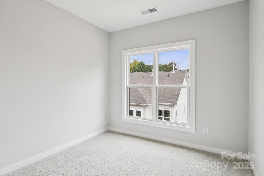 Spacious, unfurnished interior of a new home in Walk23, Huntersville (Image 19).