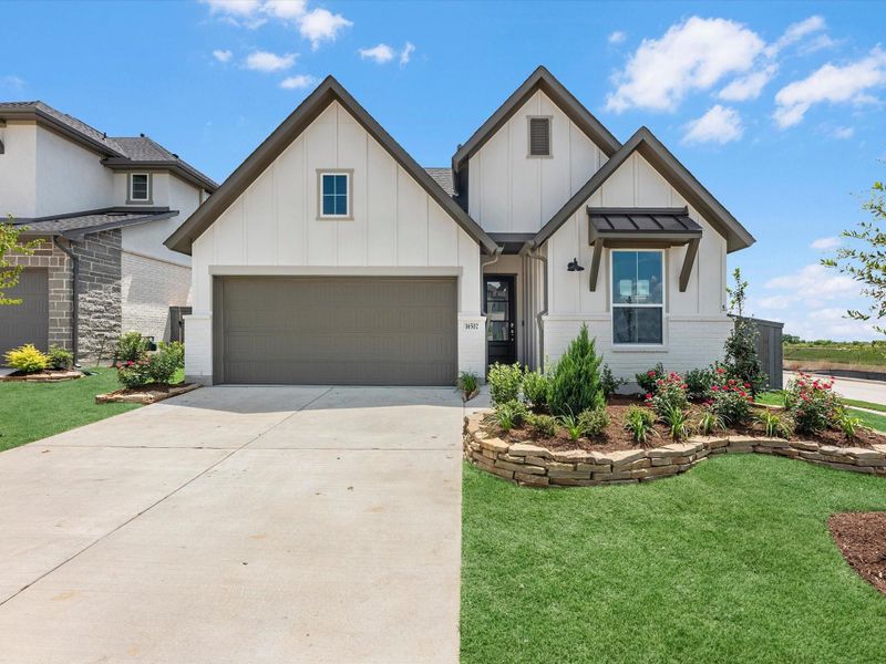 Front exterior of a new home in Jubilee 50′, Hockley, TX, highlighting curb appeal (Image 1). Front exterior of a new home in Jubilee 50′, Hockley, TX, highlighting curb appeal (Image 1).