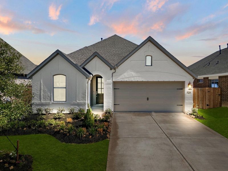 Front exterior of a new home in Escondido, Magnolia, TX, highlighting curb appeal (Image 4).