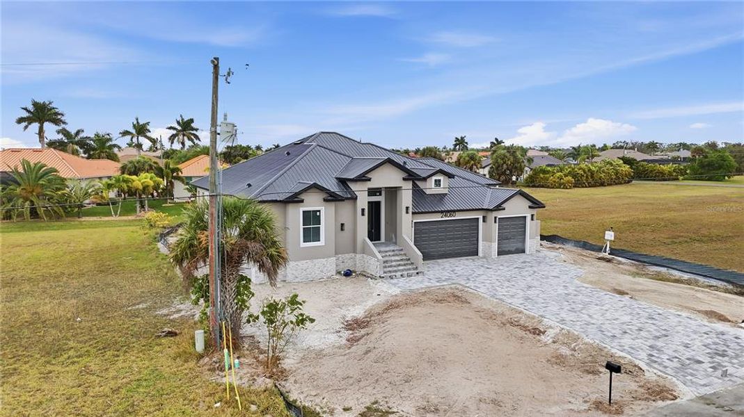 Front exterior of a new home in , Punta Gorda, FL, highlighting curb appeal (Image 22).