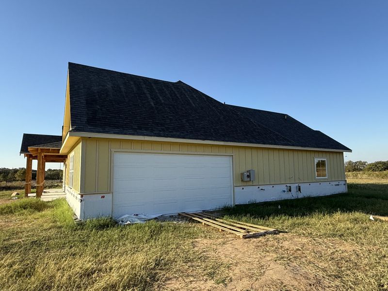 Front exterior of a new home in Oak Water Ranch, Granbury, TX, highlighting curb appeal (Image 2).