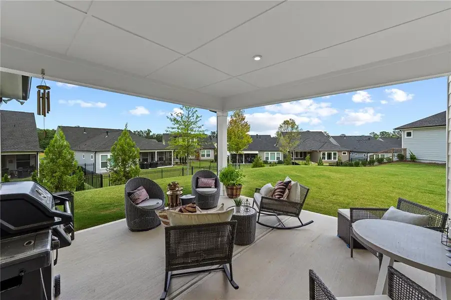 Exterior details and patio area of a home in Crescent Pointe at Great Sky, Canton (Image 23).