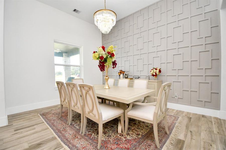 formal dining with custom accent wall