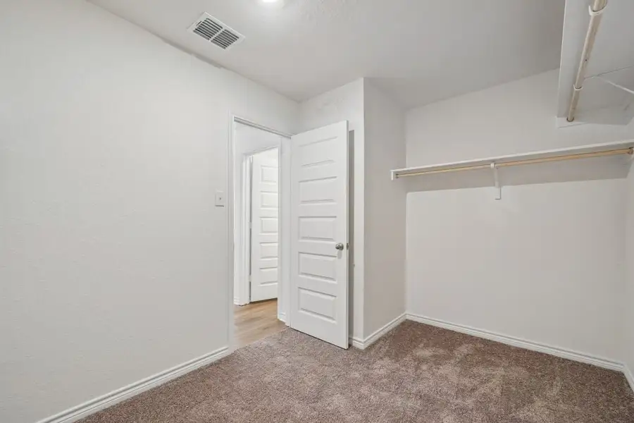 Spacious, unfurnished interior of a new home in Preserve at Culebra - Sterling Collection, San Antonio (Image 23).
