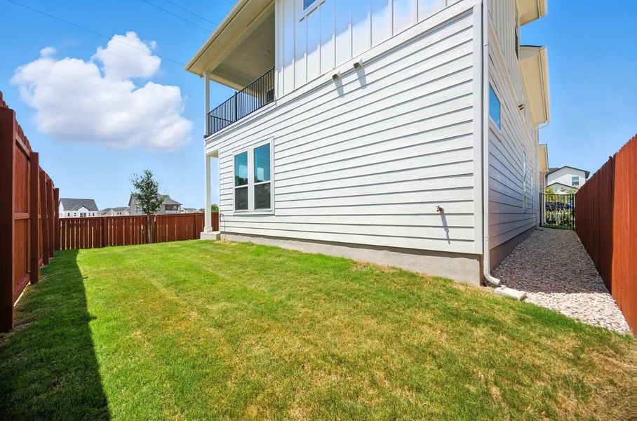 Front exterior of a new home in Foxfield, Austin, TX, highlighting curb appeal (Image 13). Front exterior of a new home in Foxfield, Austin, TX, highlighting curb appeal (Image 13).