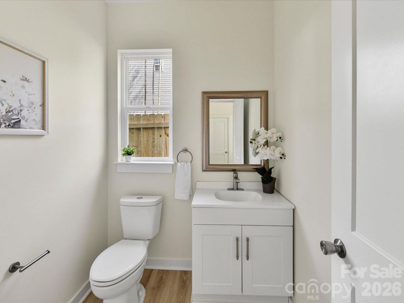 Stylish powder room featuring modern fixtures.