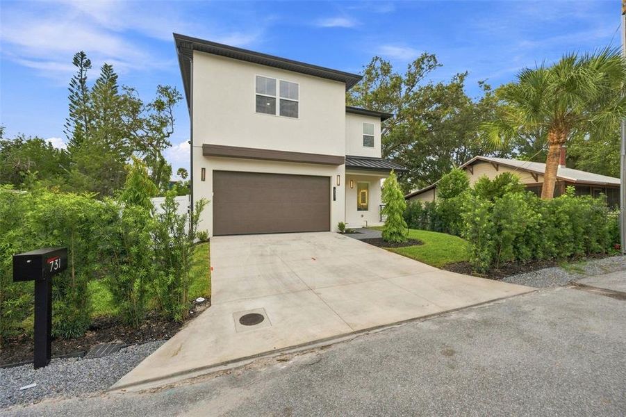 Front exterior of a new home in , Sarasota, FL, highlighting curb appeal (Image 24).