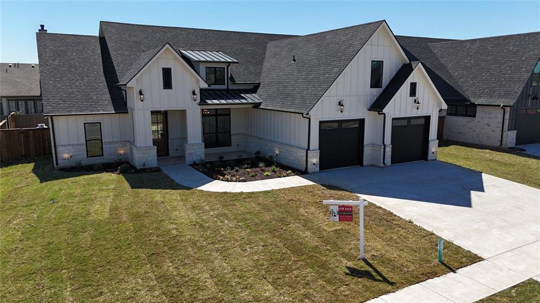 Front exterior of a new home in , Pottsboro, TX, highlighting curb appeal (Image 26).
