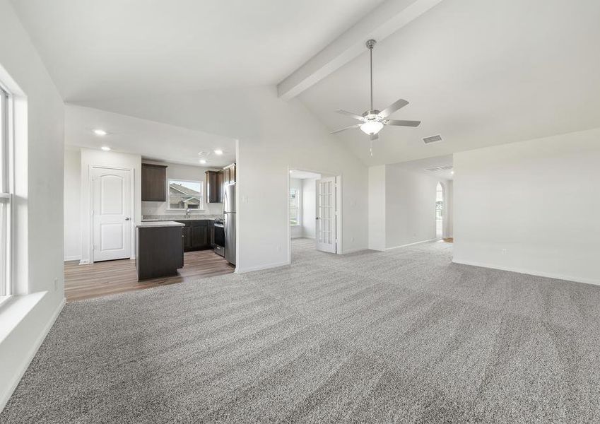 The family room of the Sabine plan sits right off of the kitchen.