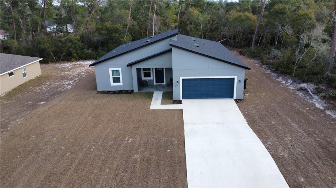 Front exterior of a new home in , Ocala, FL, highlighting curb appeal (Image 25).