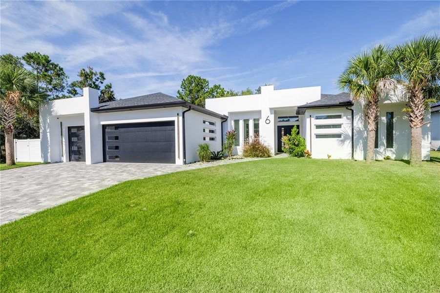 Front exterior of a new home in , Palm Coast, FL, highlighting curb appeal (Image 31).