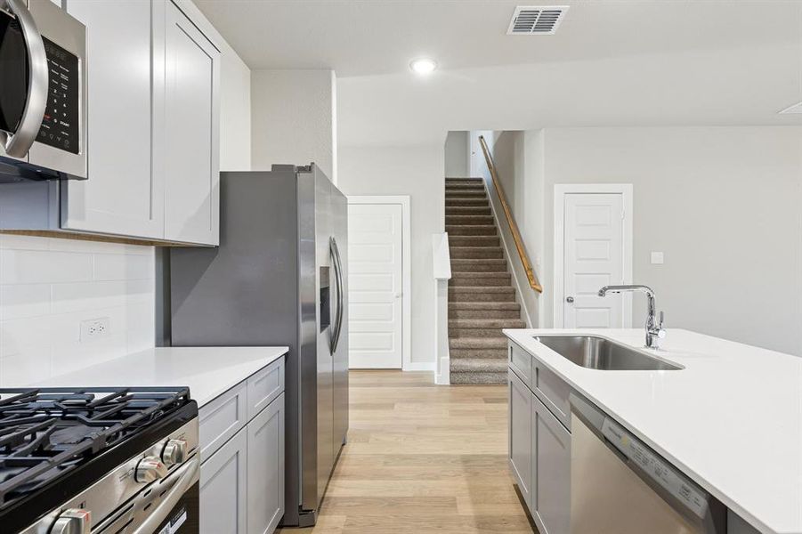 Kitchen in the Haylee home plan by Trophy Signature Homes - REPRESENTATIVE PHOTO Kitchen in the Haylee home plan by Trophy Signature Homes - REPRESENTATIVE PHOTO
