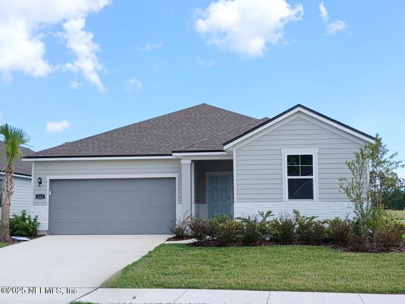 Front exterior of a new home in Magnolia Series at Seminole Palms, Palm Coast, FL, highlighting curb appeal (Image 1).