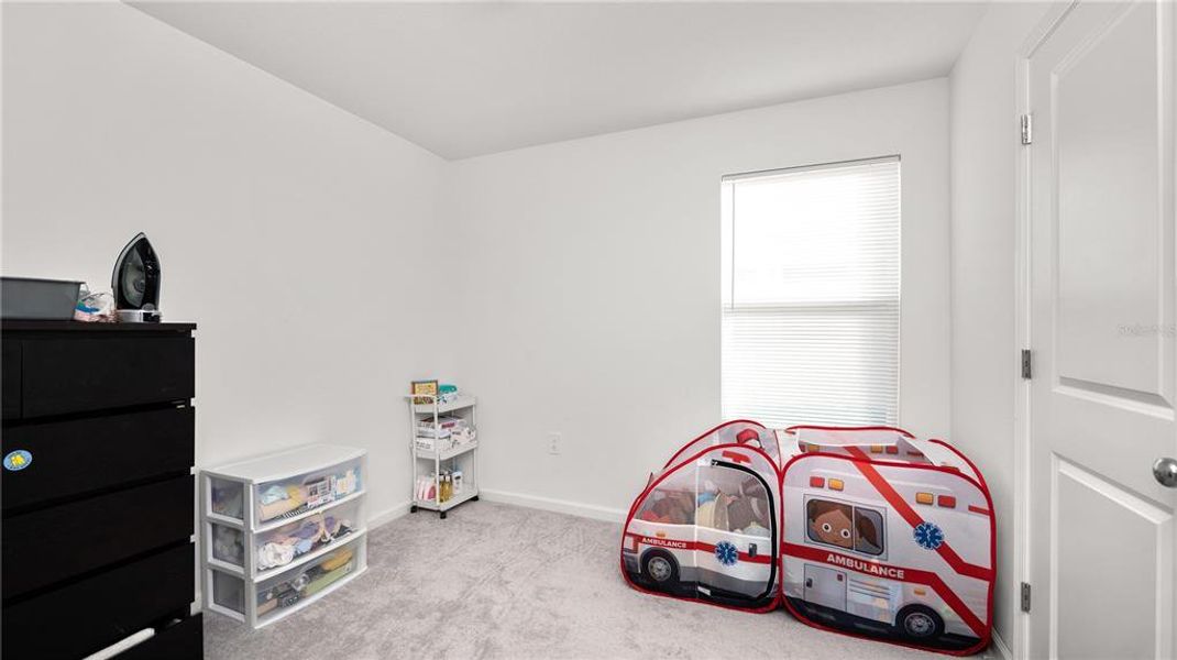 Furnished interior view inside a new home in Peace Creek Reserve: Legacy Collection, Winter Haven (Image 15).