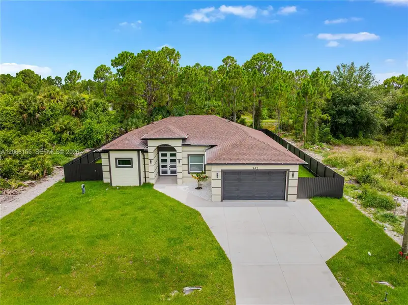 Front exterior of a new home in , Lehigh Acres, FL, highlighting curb appeal (Image 1). Front exterior of a new home in , Lehigh Acres, FL, highlighting curb appeal (Image 1).